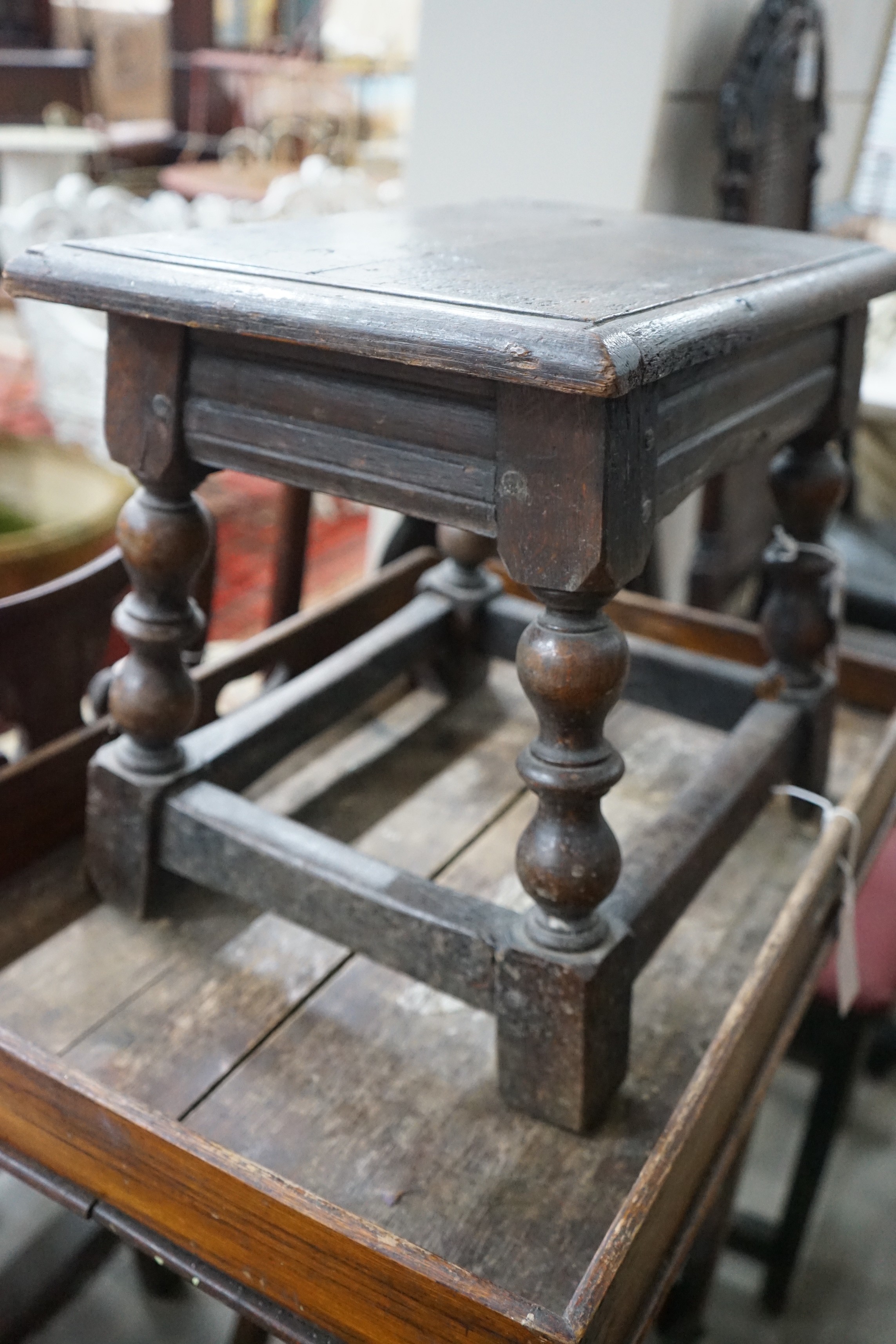 An early 18th century style oak joint stool, width 46cm, depth 30cm, height 38cm and a Victorian butler's tray on stand